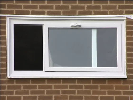 Slider window with one sash slid horizontally past the other